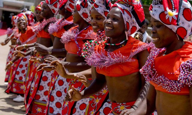 <p>Dancers in traditional dress, Kenya. <em>Photo by Kate Holt/Flickr</em></p>